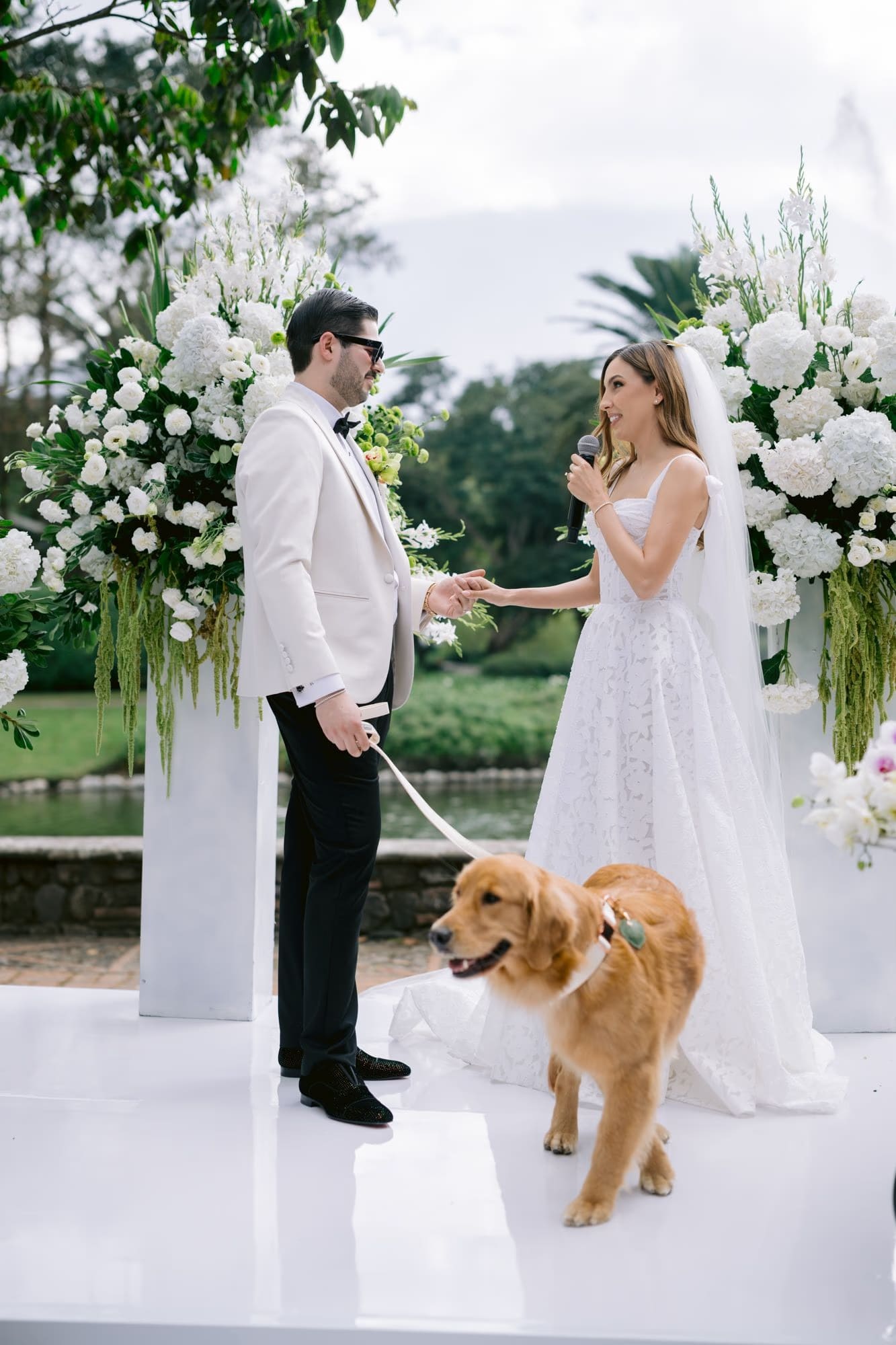 Nala the golden retriever circles the couple as Caro speaks her vows — Villa Bokeh garden wedding.