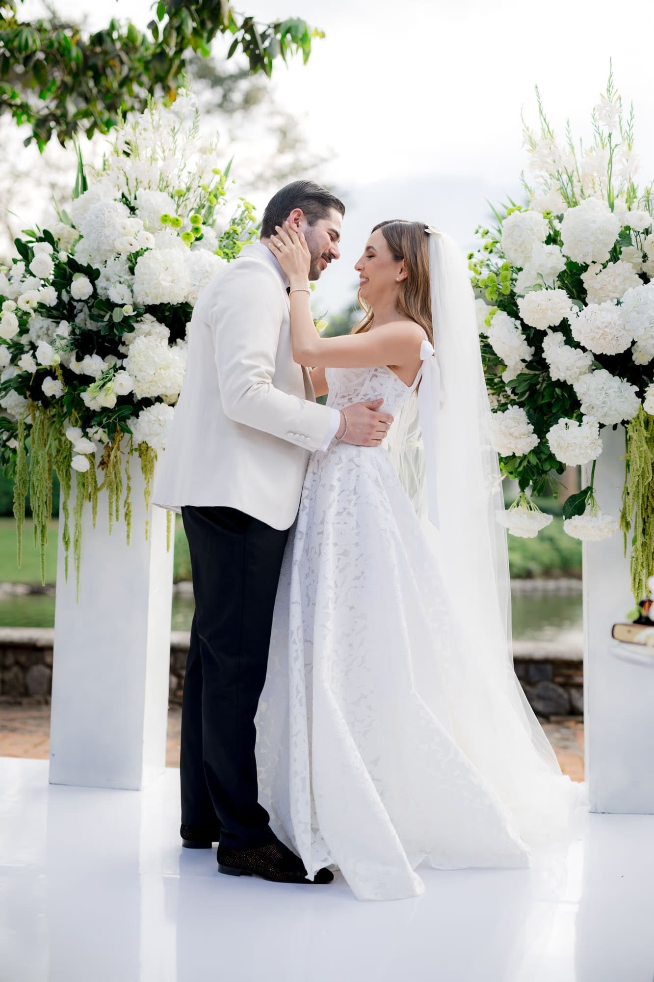 Couple embraces forehead-to-forehead at the altar just after the first kiss — Antigua Guatemala wedding.