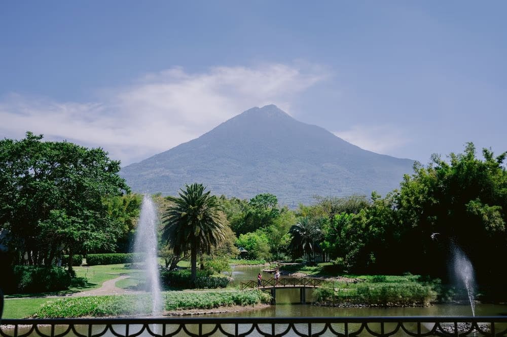 Garden fountains and the volcano view set the scene for a destination wedding in Antigua Guatemala.