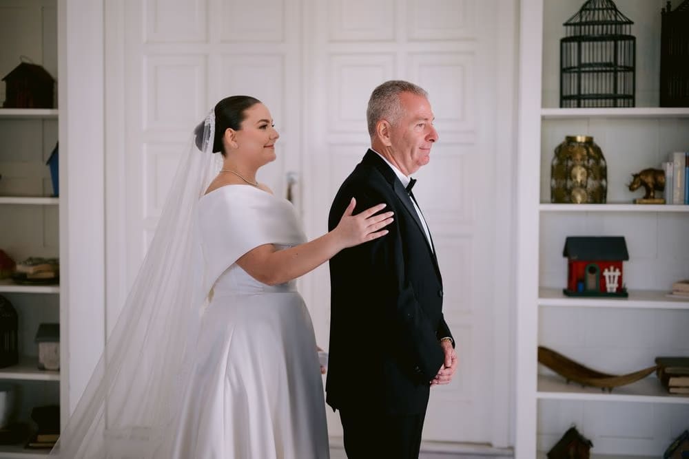 Johanna approaches her father for their first look before walking down the aisle.