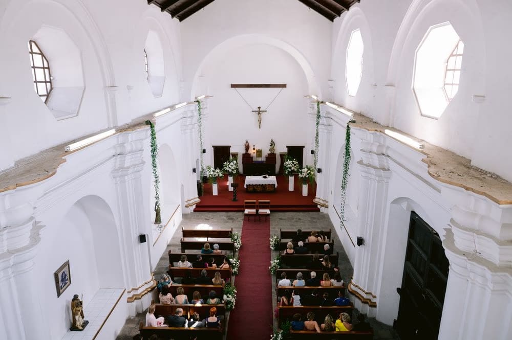 Aerial view of the whitewashed church nave decorated with ivy garlands before the ceremony in Antigua Guatemala.