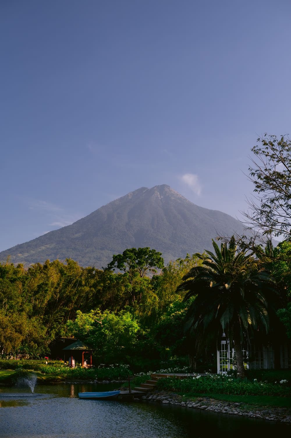 Volcano views over the tropical gardens and lily pond at Villa Bokeh — destination wedding setting.