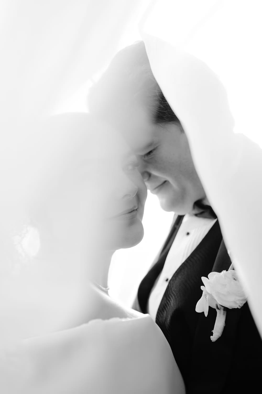 Bride Johanna and groom Thomas share an intimate moment under the veil at Villa Bokeh, Antigua Guatemala — black-and-white editorial wedding portrait.